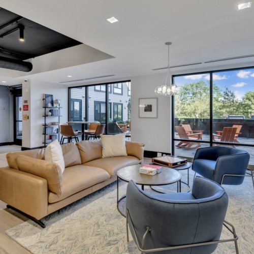 Community lounge featuring a billiards table, board games, tv, and entertainment kitchen Community lounge featuring a billiards table, board games, tv, and entertainment kitchen