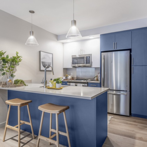 Chef-inspired kitchen Chef-inspired kitchen with modern duel-tone cabinetry, stainless steel appliances, and quartz countertops